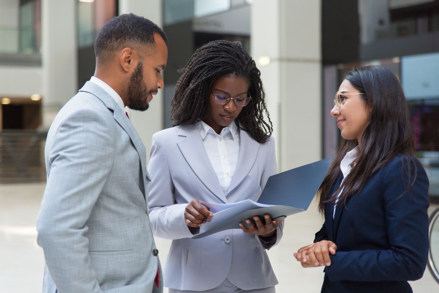 ApexTalents recruiters reviewing candidate profiles with a client